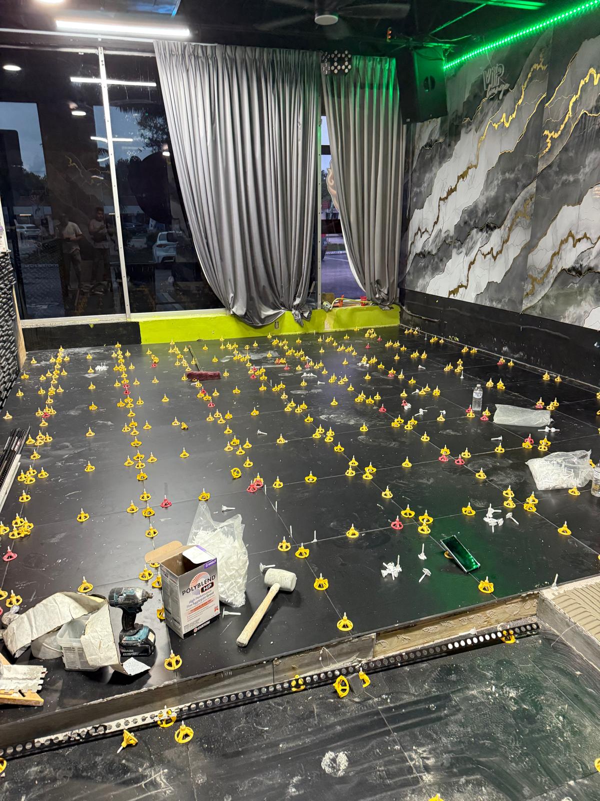 VIP lounge black floor tile installation
